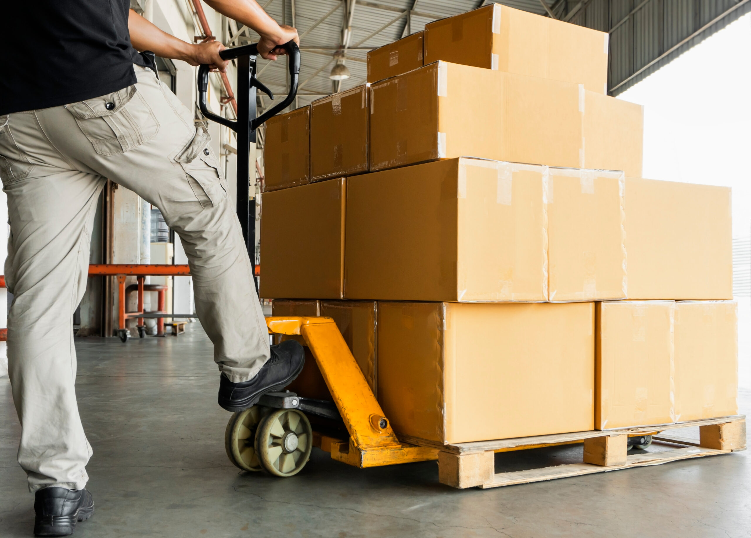 Worker,Courier,Unloading,Shipment,Goods,,Hand,Pallet,Truck,And,Stack